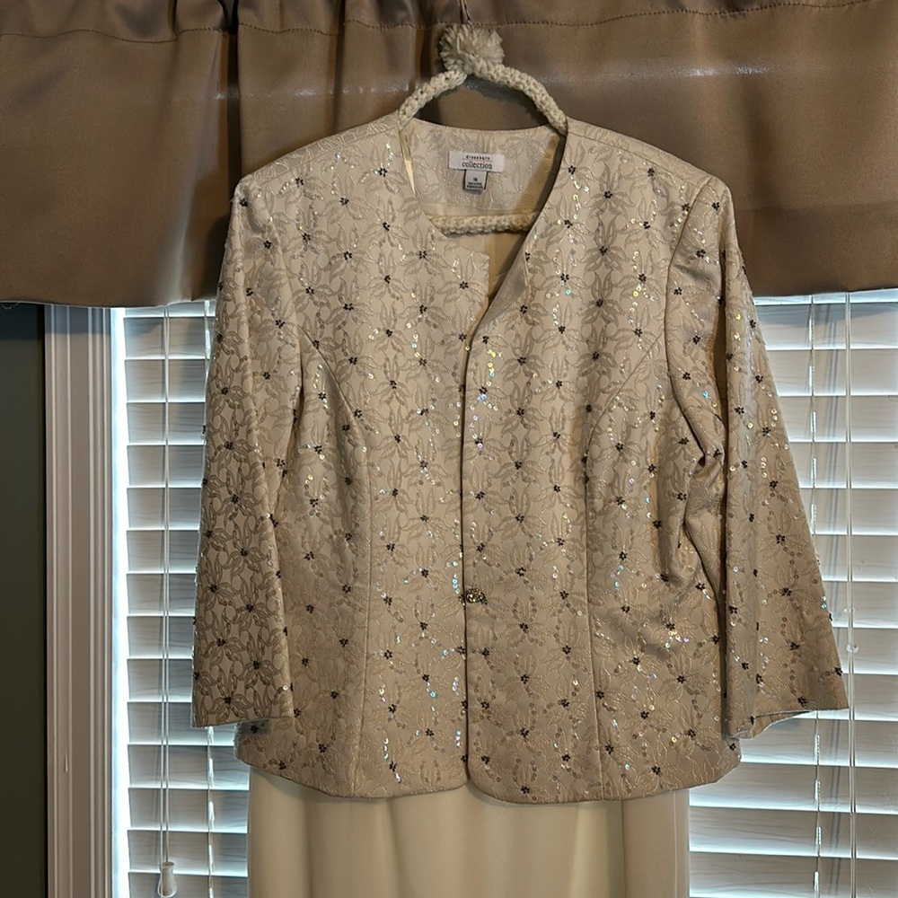 Worn only once. Ivory sleeveless dress with fitted open jacket. Size 16.